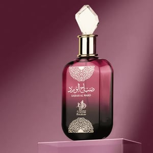 Perfume bottle with intricate design on a purple background