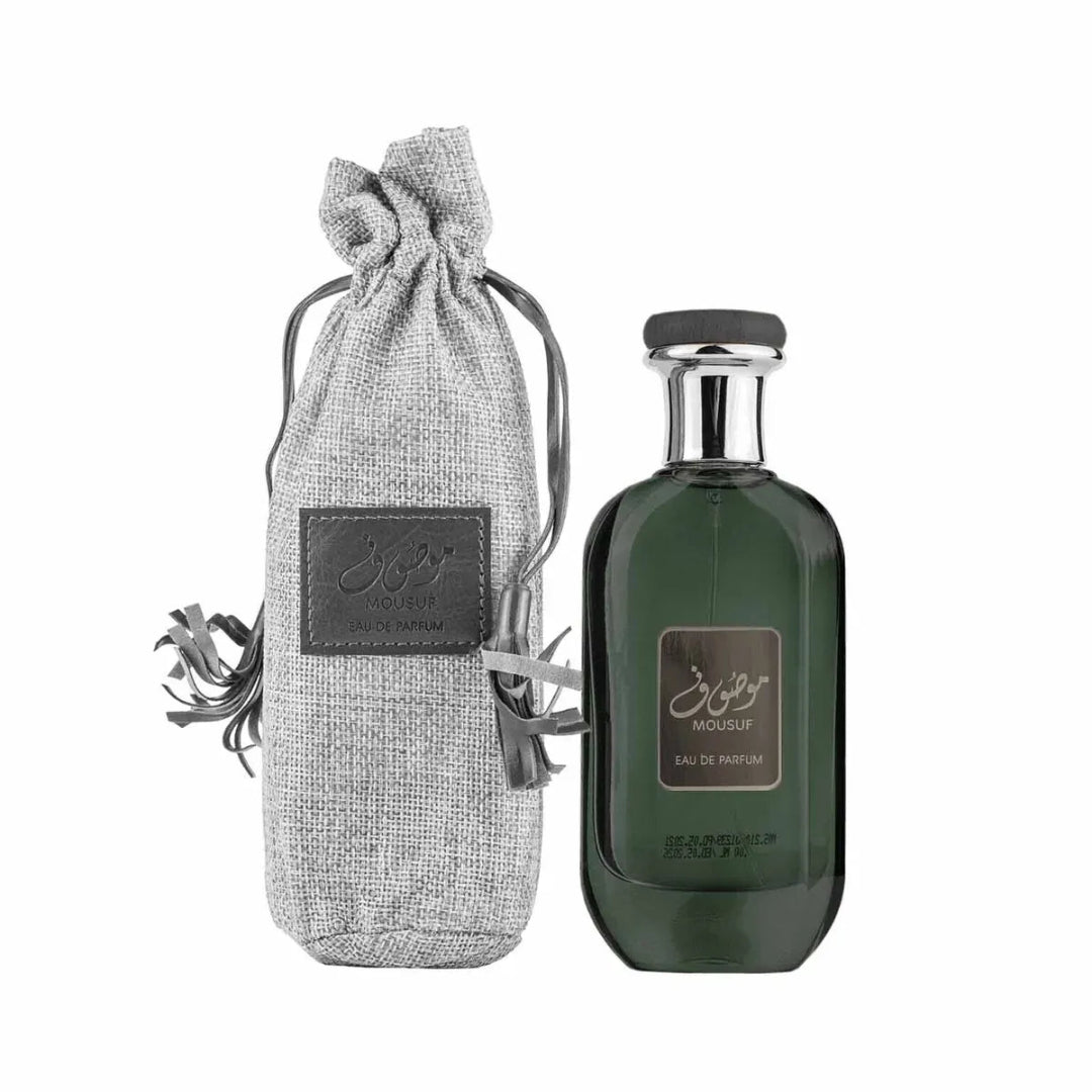 Green perfume bottle with gray drawstring bag on a white background