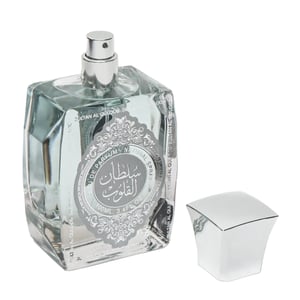 Clear perfume bottle with silver cap on a white background