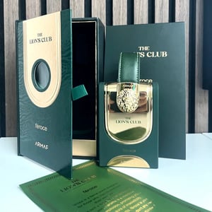 ARMAF The Lion's Club feroce perfume bottle and packaging on a wooden background