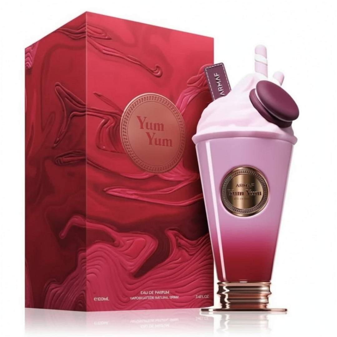 Pink and red Yum Yum perfume Box And bottle with matching packaging on a white background