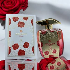 Opulent perfume bottle and packaging with red roses on a white background