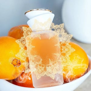 Sham Perfume Woman Gulf Orchid with floating amber lace and soft musk glow; bottle and box perfectly sharp.