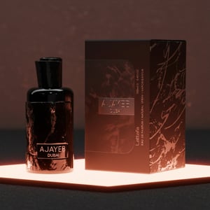 Ajayeb Dubai bottle glowing under TRX’s rose-gold interior lighting