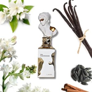 Perfume bottle labeled 'Her Confession' with vanilla beans, flowers, and cinnamon sticks on a white background