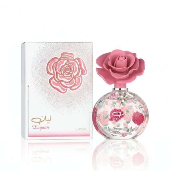 Perfume bottle with pink rose design and matching box on a white background