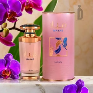 MAYAR Lattafa perfume bottle and pink cylindrical container with purple orchids on a marble surface.