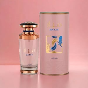 Perfume bottle and packaging with 'MAYAR' branding on a pink background