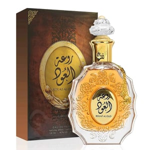 Perfume bottle and packaging with intricate designs on a white background