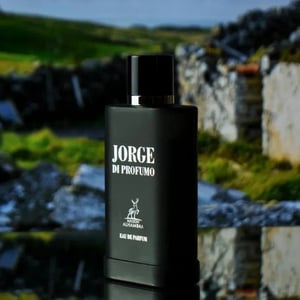 Black perfume bottle labeled 'Jorge Di Profumo' with a scenic background