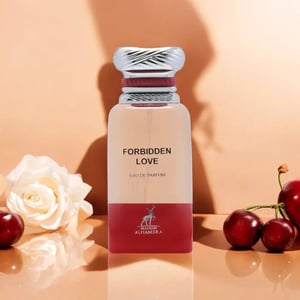 Perfume bottle labeled 'Forbidden Love' with a white rose and cherries on a peach background