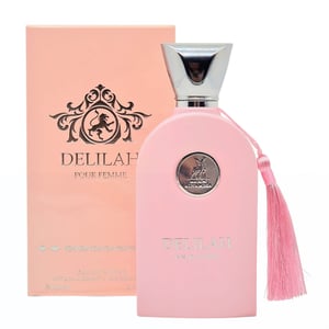 Pink Delilah perfume bottle with tassel and packaging on a white background