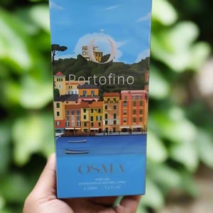 OSMA Portofino perfume packaging on a wooden surface