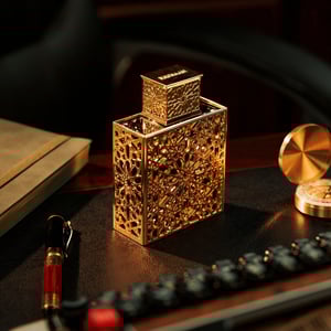 rayhaan elixir perfume bottle with intricate design on a dark surface