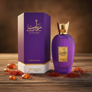 Rabab Gems by Zimaya perfume bottle with saffron and amber stones under warm light Malaysia